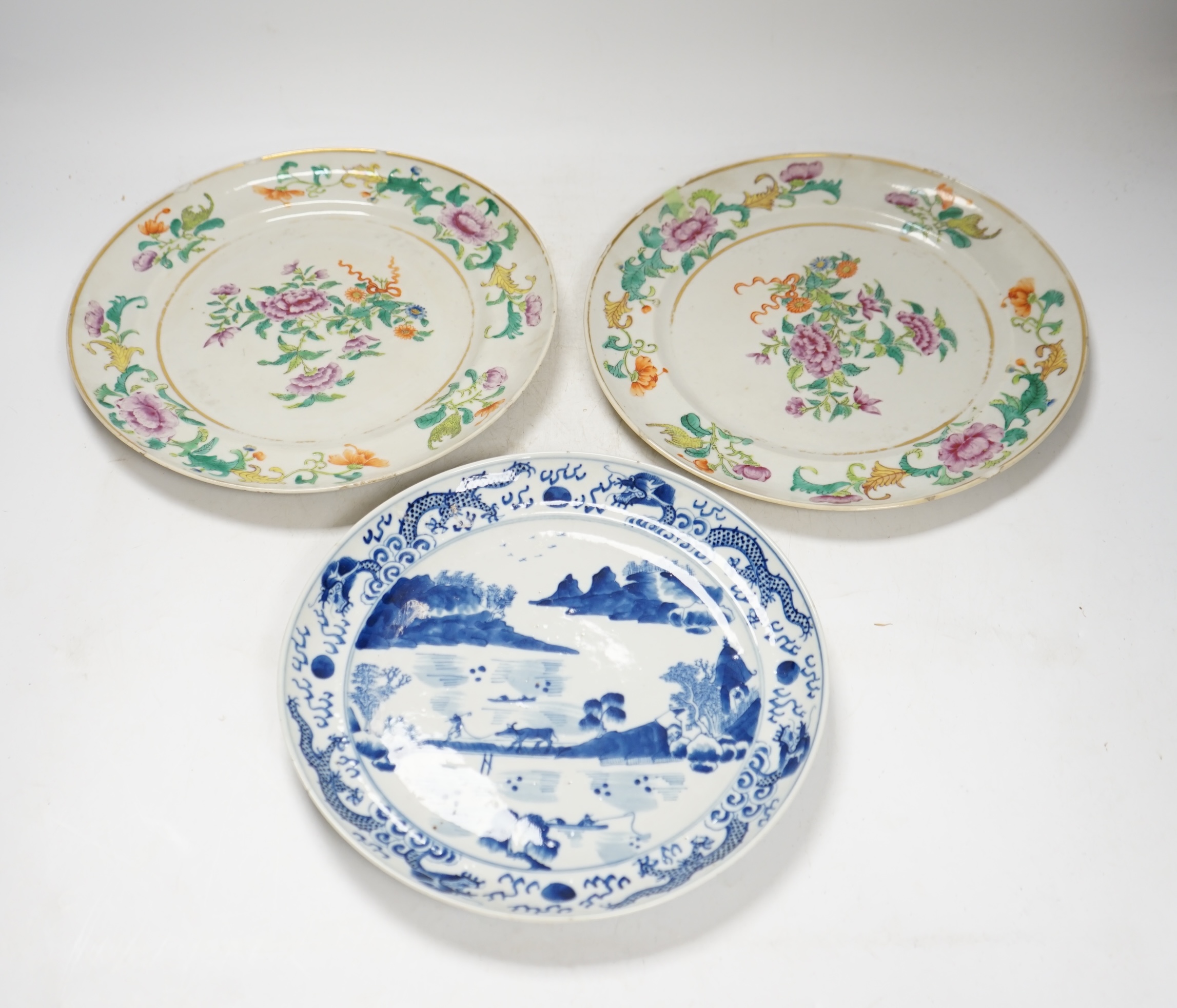 A pair of 19th century Chinese famille rose plates and another blue and white, largest 25cm diameter. Condition - blue and white good, others poor to fair
